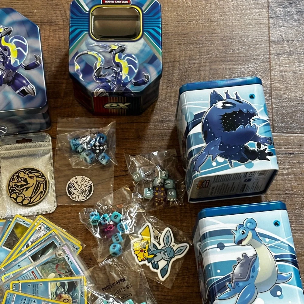 Pokemon Card Collection with Tins and Accessories 25 card Mystery Tin plus bonus